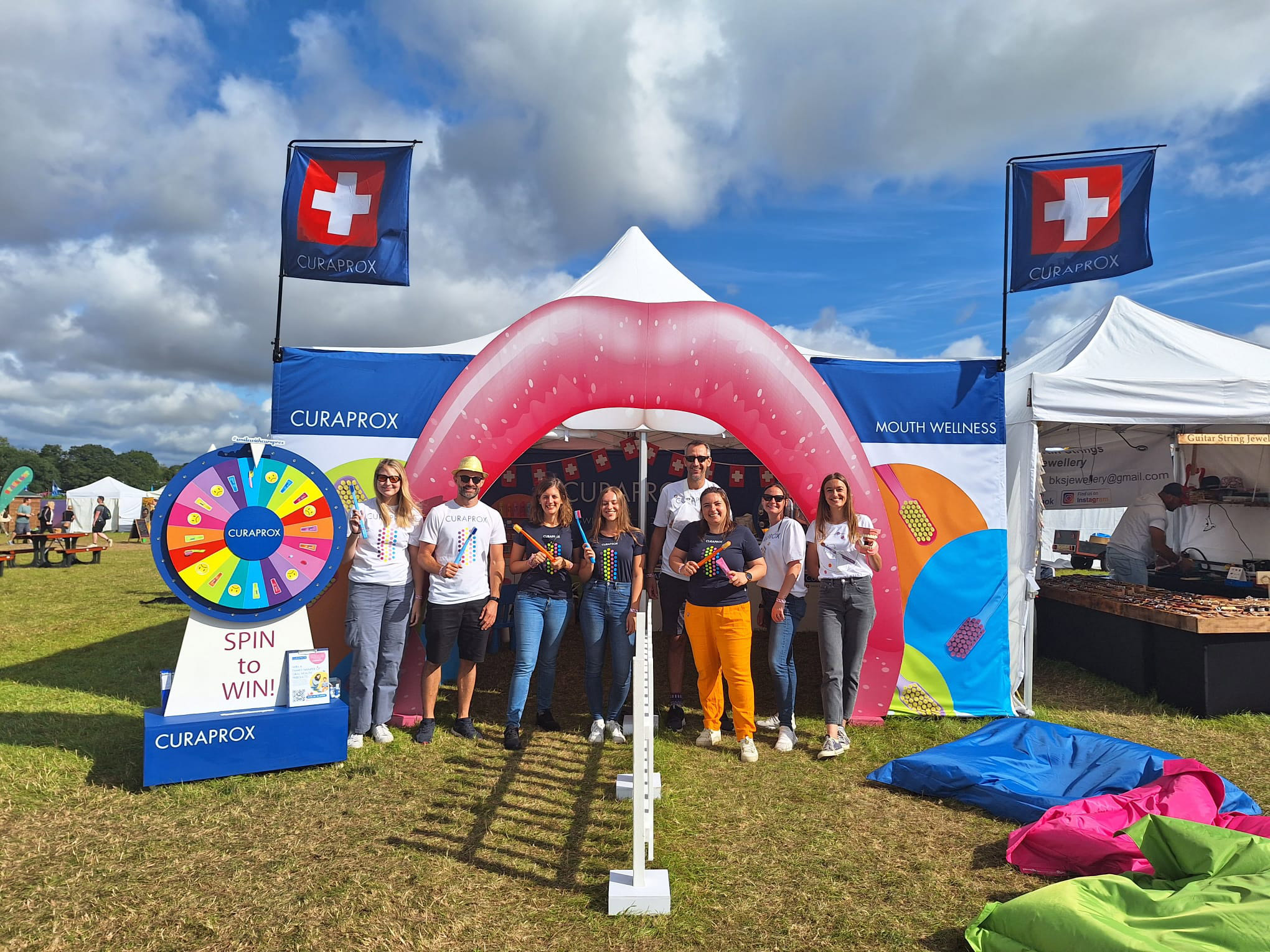 Photo of the Curaprox event tent and all the people involved